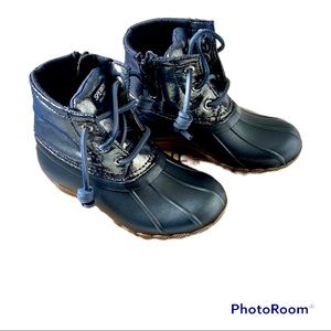 Brand new. Never worn. Sperry saltwater boot in metallic blue.